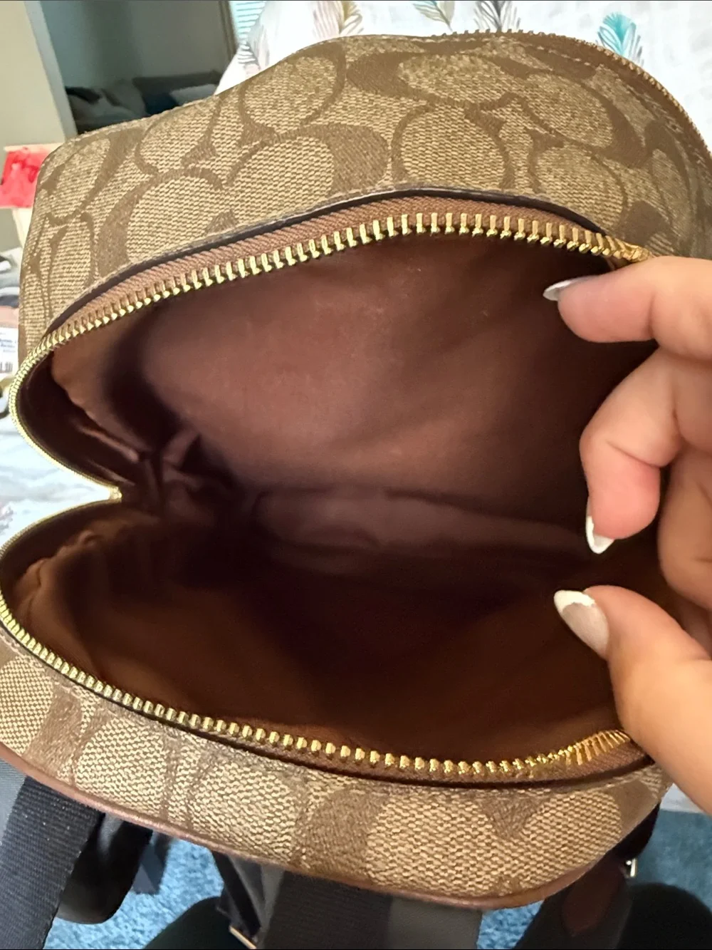 Coach Brown Signature Leather Backpack with gold hardware